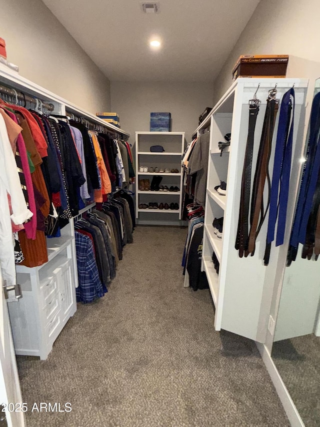 spacious closet featuring visible vents and carpet floors