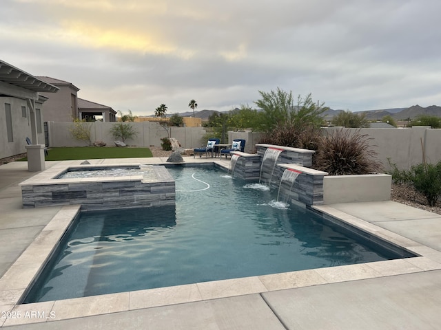 view of pool featuring a patio, a fenced backyard, an in ground hot tub, and a fenced in pool