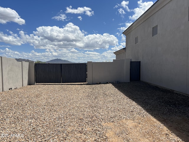 view of yard featuring a gate and fence