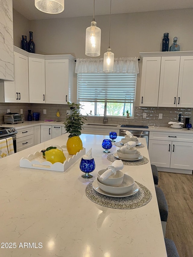 kitchen featuring tasteful backsplash and white cabinets