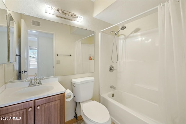 full bath with visible vents, toilet, shower / bath combo with shower curtain, and vanity