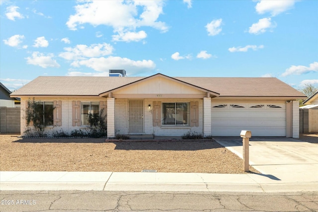 ranch-style house featuring a garage, brick siding, concrete driveway, and a shingled roof