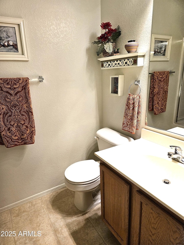1265 S Aaron Unit 299, Mesa, AZ 85209 - bathroom featuring toilet, vanity, baseboards, and tile patterned flooring