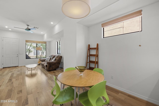 dining space with recessed lighting, light wood-style flooring, and baseboards