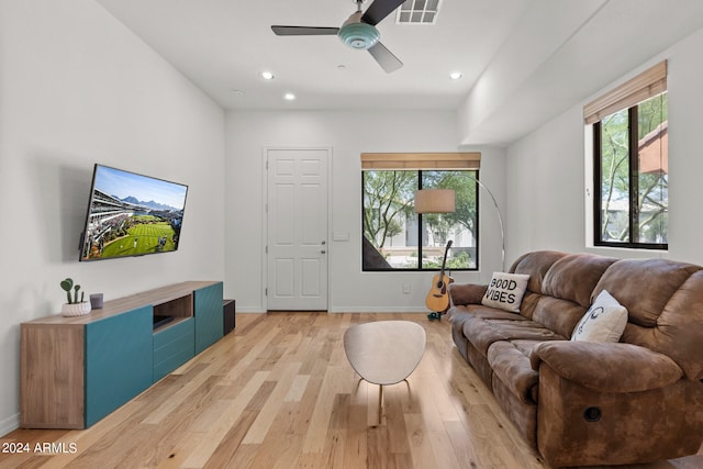 living room featuring ceiling fan and wood-type flooring