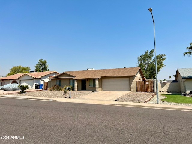 ranch-style house featuring a garage