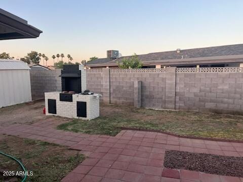18045 N 20th Ln N, Phoenix, AZ 85023 - fenced backyard with a patio, a shed, and a fireplace