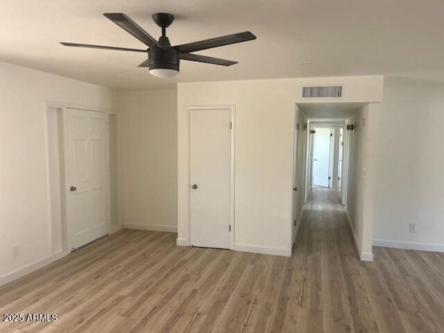 18045 N 20th Ln N, Phoenix, AZ 85023 - unfurnished bedroom featuring light wood-style flooring and a ceiling fan