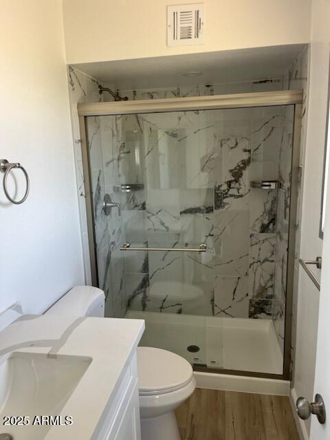 18045 N 20th Ln N, Phoenix, AZ 85023 - full bath featuring a marble finish shower, vanity, and wood finished floors