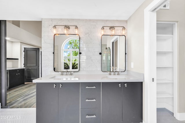 bathroom with built in features and vanity