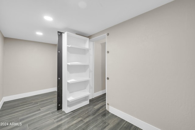 bathroom with hardwood / wood-style flooring