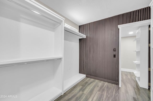 walk in closet featuring hardwood / wood-style flooring