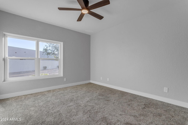 unfurnished room featuring ceiling fan and carpet floors