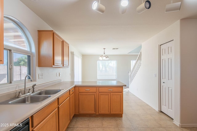 3365 N Sunaire, Mesa, AZ 85215 - kitchen featuring a sink, a peninsula, plenty of natural light, and a chandelier