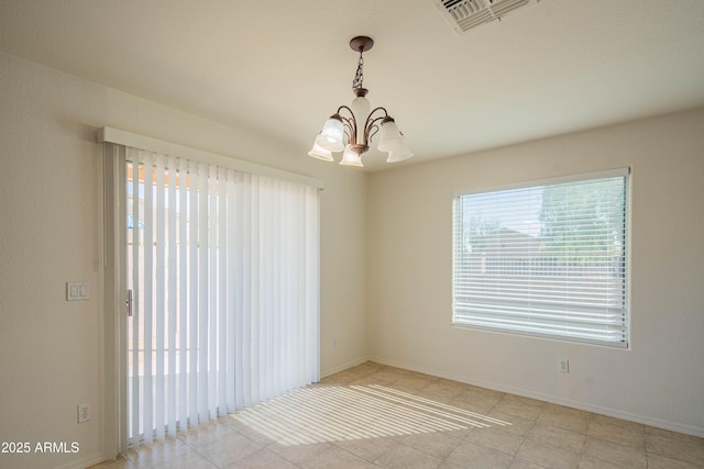 3365 N Sunaire, Mesa, AZ 85215 - spare room featuring a chandelier, light tile patterned floors, and baseboards