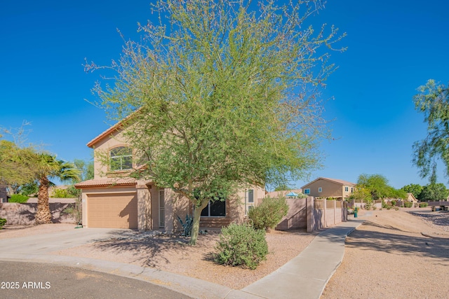3365 N Sunaire, Mesa, AZ 85215 - view of front of property featuring concrete driveway, a garage, stucco siding, and a tiled roof