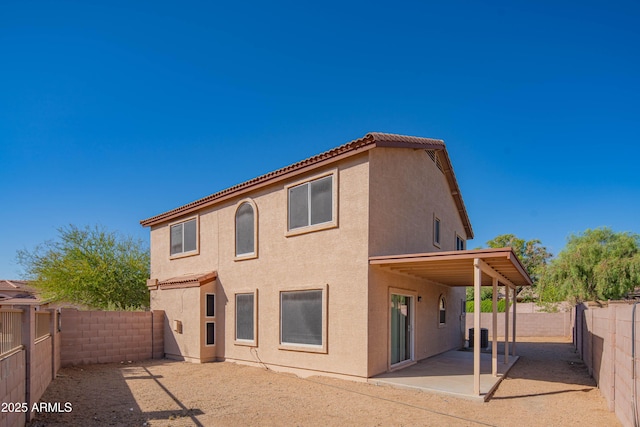 3365 N Sunaire, Mesa, AZ 85215 - rear view of house featuring stucco siding, a patio, a fenced backyard, and a tiled roof