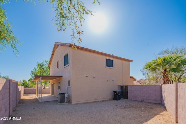 3365 N Sunaire, Mesa, AZ 85215 - back of property with stucco siding, a fenced backyard, and central AC