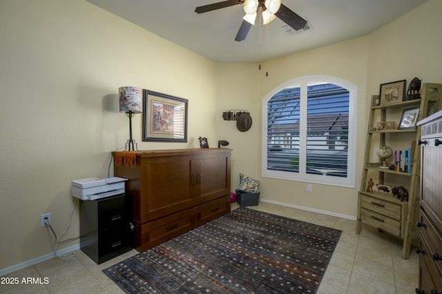 home office featuring light tile patterned flooring, visible vents, and baseboards