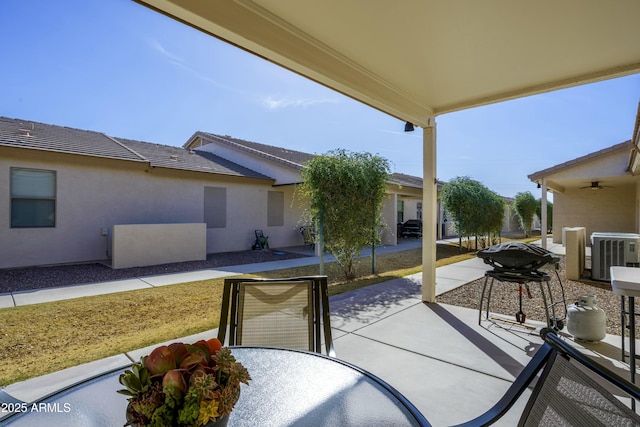 view of patio featuring central AC and outdoor dining area