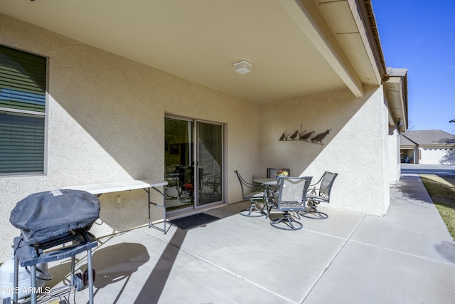 view of patio / terrace with outdoor dining space and a grill