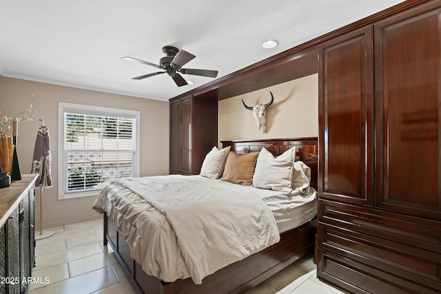 bedroom with light tile patterned flooring, ornamental molding, and ceiling fan