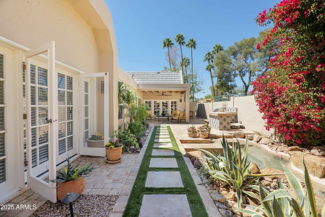 view of patio / terrace with french doors and a fenced backyard