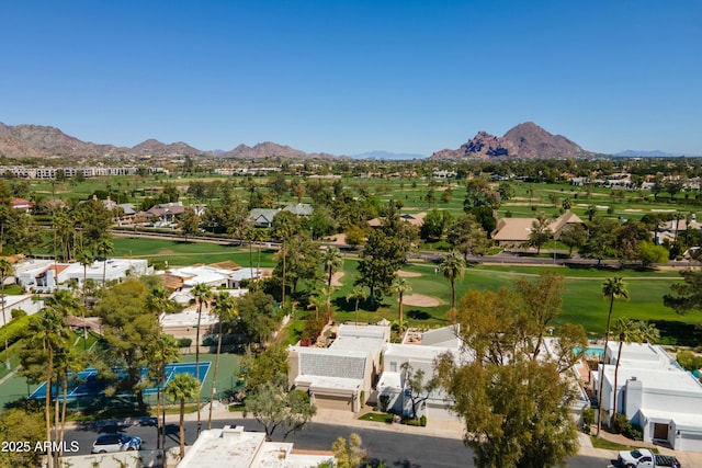 birds eye view of property featuring view of golf course and a mountain view