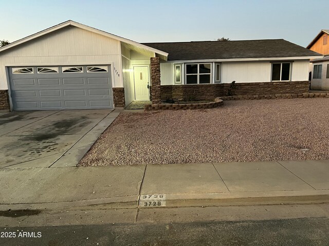 ranch-style house featuring a garage