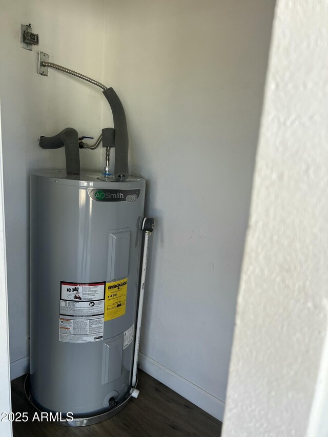 utility room featuring electric water heater