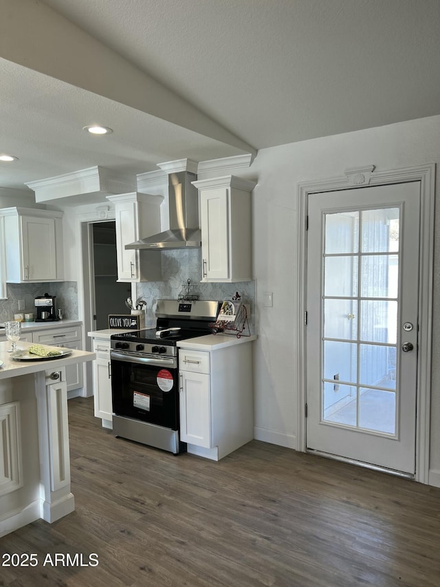 kitchen with white cabinetry, stainless steel electric stove, and wall chimney exhaust hood