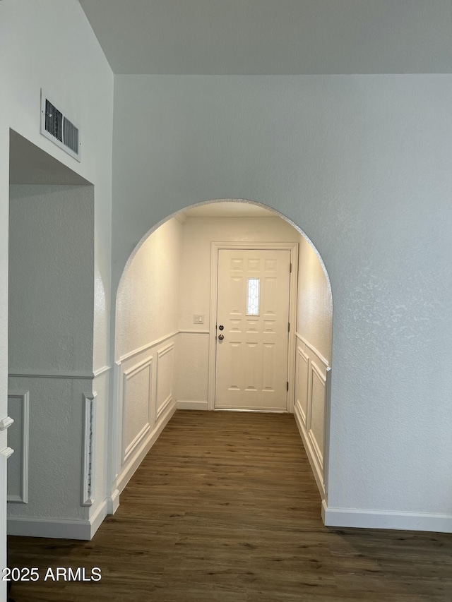 hallway featuring dark wood-type flooring