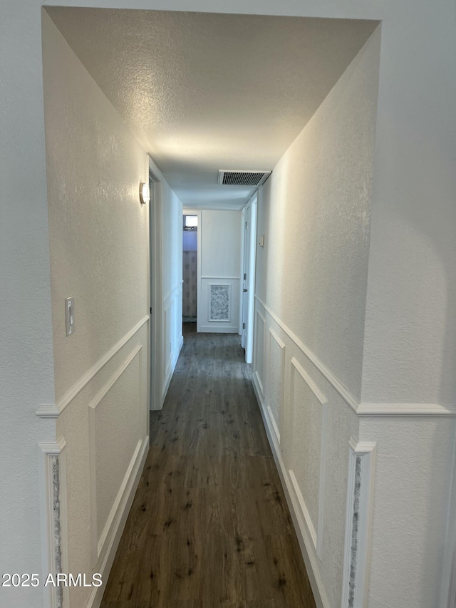 hall featuring dark wood-type flooring