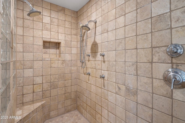 full bathroom with a tile shower