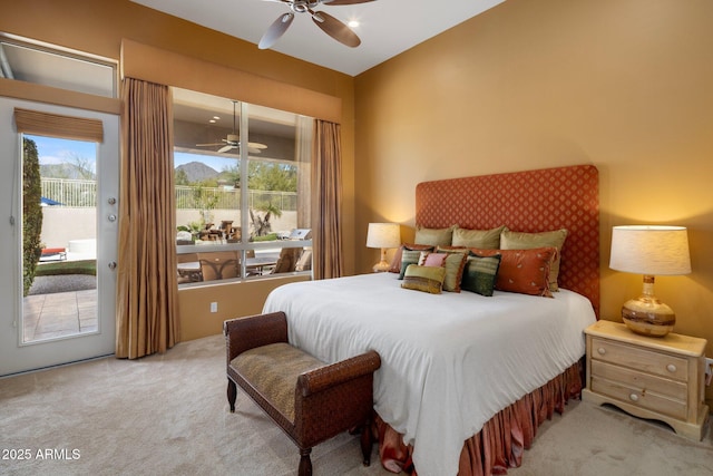 carpeted bedroom with access to exterior and multiple windows