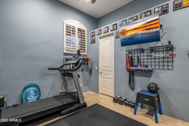 workout area featuring tile patterned floors