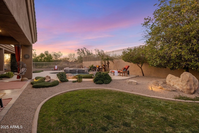view of yard featuring a patio area, a fenced in pool, and a fenced backyard
