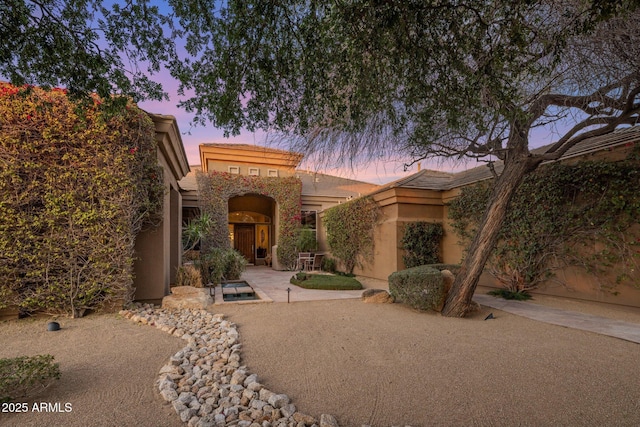 view of front of house featuring stucco siding