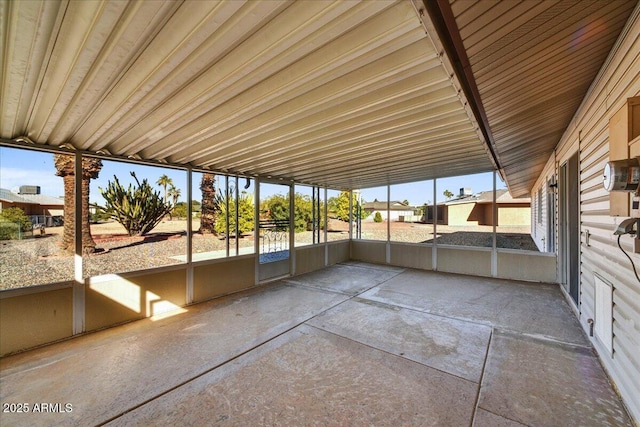 unfurnished sunroom with a wealth of natural light