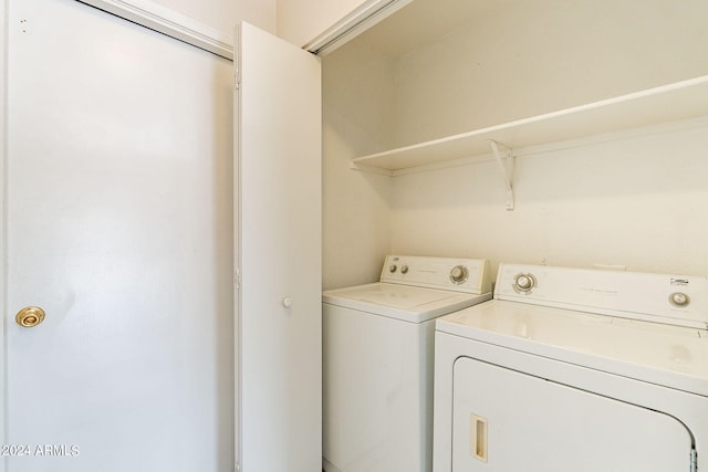 clothes washing area featuring washing machine and clothes dryer