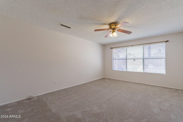 16410 S 46th Pl, Phoenix, AZ 85048 - spare room featuring visible vents, baseboards, ceiling fan, light colored carpet, and a textured ceiling