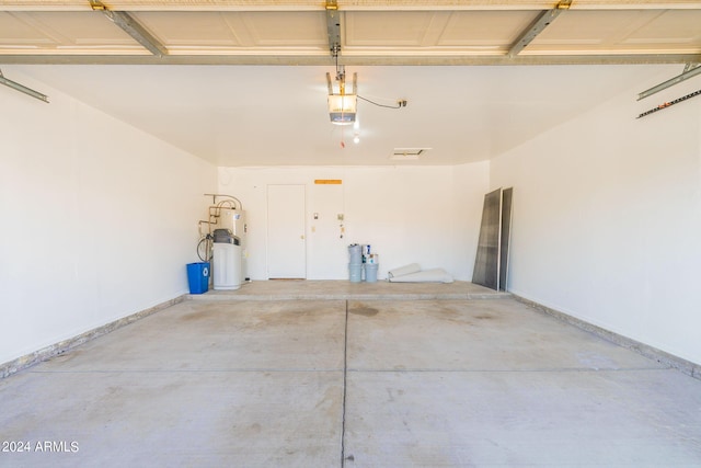 16410 S 46th Pl, Phoenix, AZ 85048 - garage featuring baseboards, a garage door opener, and water heater