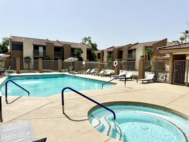 view of pool with a community hot tub