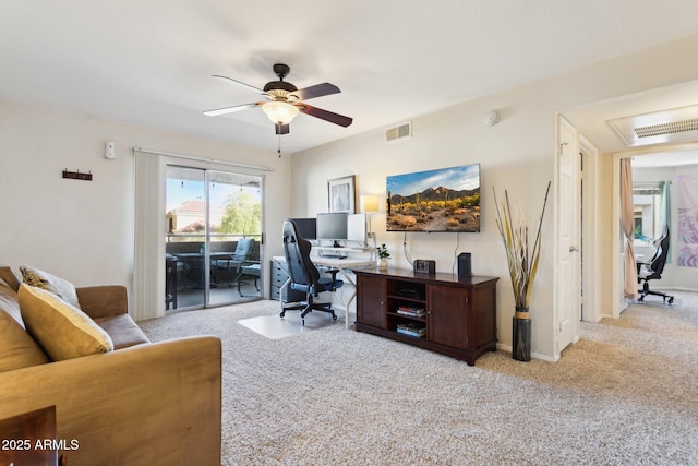 office area with light carpet, ceiling fan, and visible vents