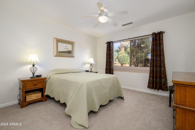 bedroom with light carpet and ceiling fan