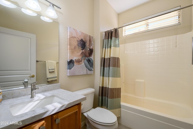 full bathroom featuring vanity, toilet, and shower / bath combo with shower curtain