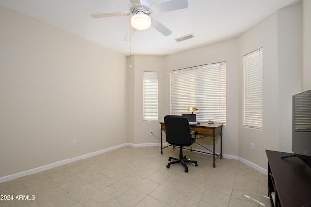 office featuring ceiling fan and light tile patterned floors