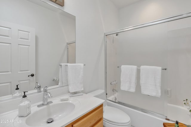 full bath with toilet, enclosed tub / shower combo, and vanity