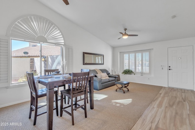 dining area with lofted ceiling, ceiling fan, and baseboards