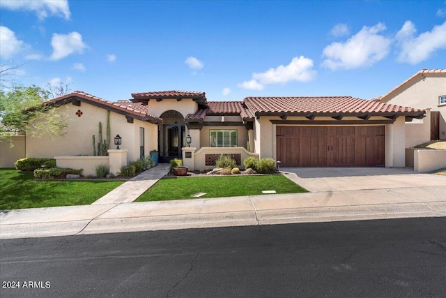 mediterranean / spanish home featuring a garage